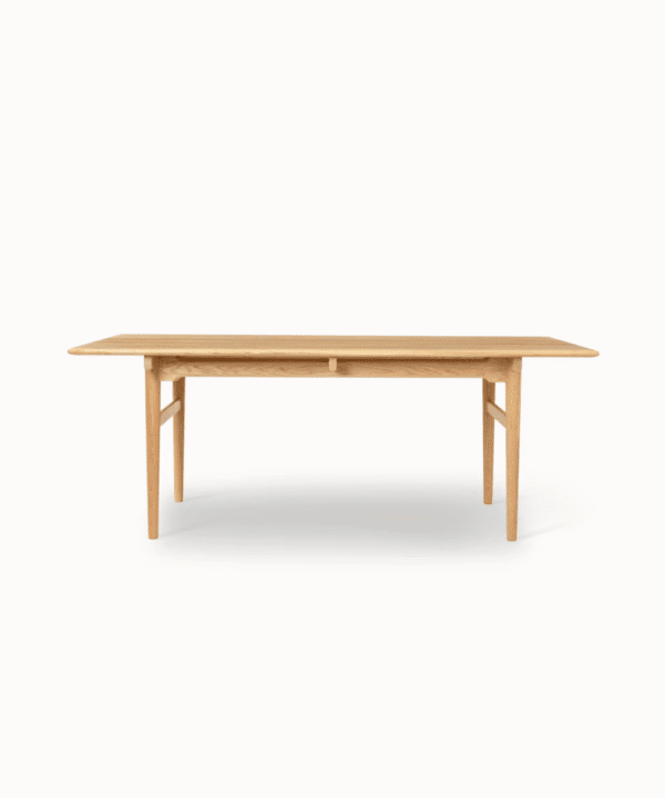 Samata solid teak dining table with oil-polished finish and tapered legs