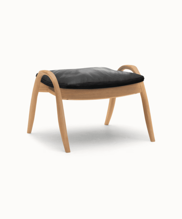 Samatā wooden footstool blending comfort and refined simplicity in a modern living room