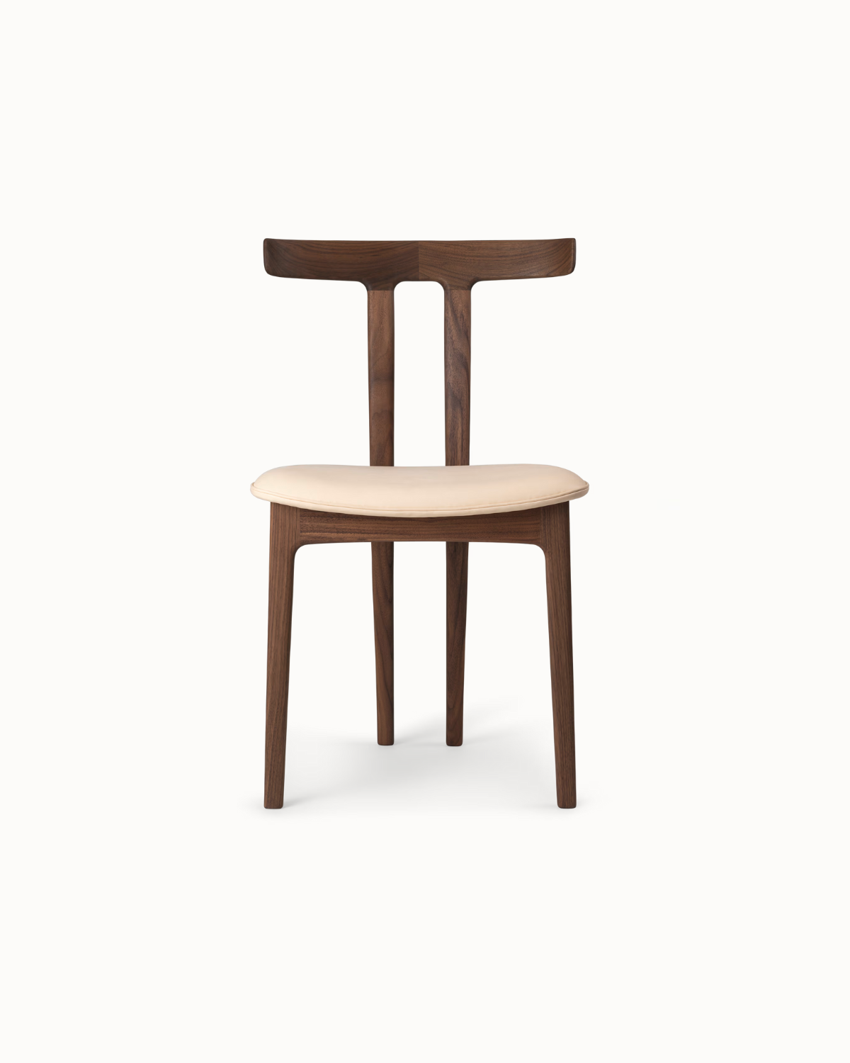 Tribhā wooden dining chair showing T-shaped backrest and sleek silhouette