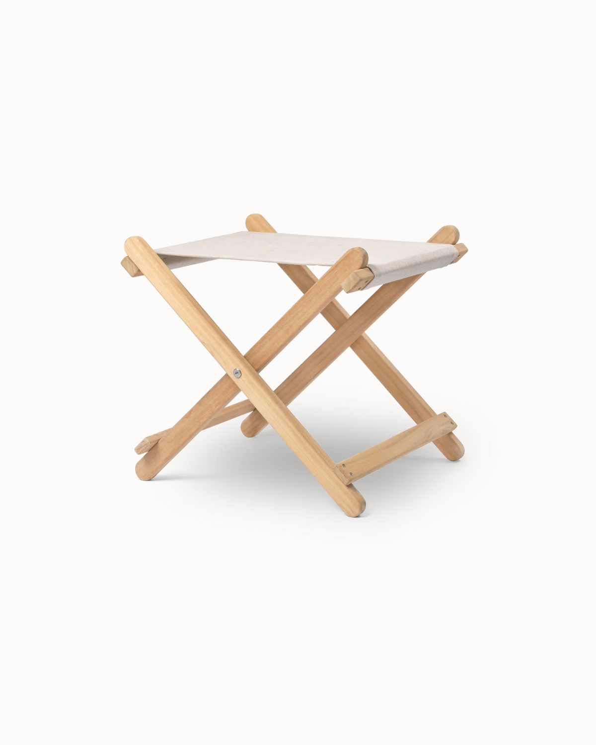 Vetrikā-Upavī teak footstool with foldable frame.